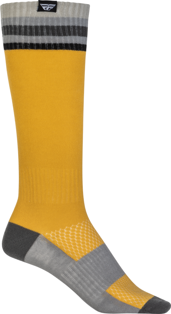 Yellow Fly Racing MX socks in size small/medium, featuring thin design and breathable fabric for motocross riding comfort.
