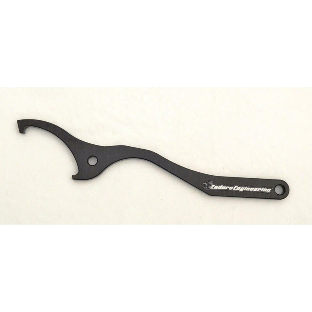 Enduro Engineering shock spanner wrench with WP plastic ring for motorcycle suspension adjustments, tool for shock removal and installation.