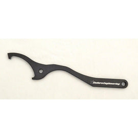 Enduro Engineering shock spanner wrench with WP plastic ring for motorcycle suspension adjustments, tool for shock removal and installation.