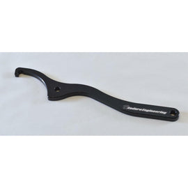 Enduro Engineering shock spanner wrench with plastic ring for WP shocks, featuring a durable metal handle and precise fit.