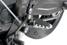 Silver PUIG Trail Footpegs for Suzuki GSX-R750 motorcycle, shown mounted on bike with textured grip surfaces