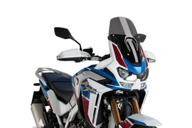 PUIG Sport Dark Smoke Windscreen for motorcycle, featuring a sleek tinted windshield with mounting brackets and aerodynamic design.