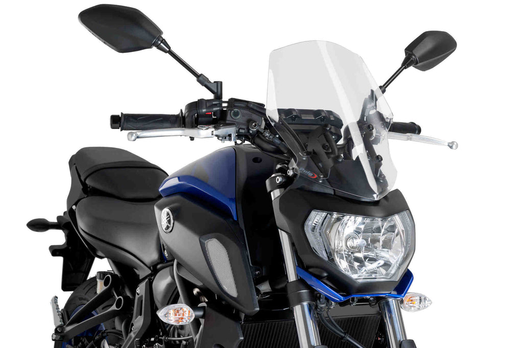 Clear PUIG windscreen for Naked New Gen Touring motorcycle, showcasing the sleek, transparent design and mounting edges.
