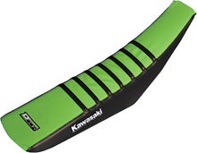 Load image into Gallery viewer, Black and green DCOR Gripper seat cover shown on a car seat, designed for a secure fit and added comfort.
