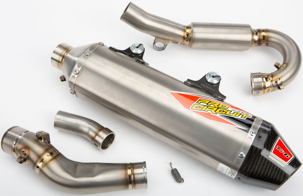 Pro Circuit Ti-6 exhaust system with polished titanium finish, featuring sleek design and exhaust pipe components.