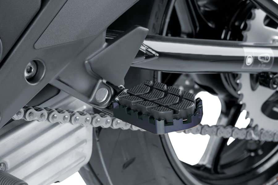 Black PUIG Enduro footpegs for motorcycle foot controls, featuring durable design and textured surfaces for grip.