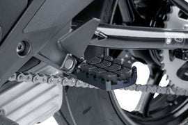 Black PUIG Enduro footpegs for motorcycle foot controls, featuring durable design and textured surfaces for grip.