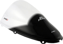 Clear PUIG racing windscreen for motorcycle, showing the transparent, aerodynamic windshield with mounting edges.