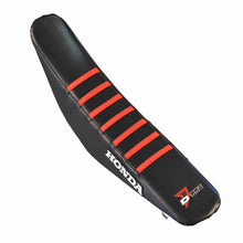 Load image into Gallery viewer, Black DCOR seat cover with red ribs, showcasing durable fabric and snug fit for automotive seats.