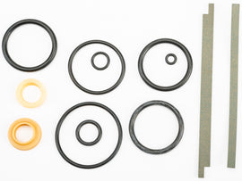 Fox suspension rebuild kit with non-CD components, featuring various seals, o-rings, and parts arranged in a clear layout.