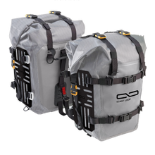 Load image into Gallery viewer, Pair of grey Giant Loop Mototrekk motorcycle panniers for luggage storage, shown mounted on a bike.