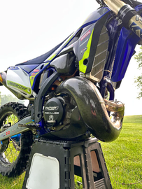 P3 Carbon Fiber Pipe Guard for Sherco 670 exhaust, lightweight protective cover on motorcycle exhaust system.