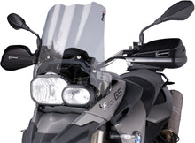 Load image into Gallery viewer, PUIG Touring Smoke Windscreen for motorcycle, clear tinted windshield with aerodynamic design and mounting hardware visible.