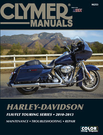 Clymer Harley Touring repair manual for 2010-2013, showing detailed pages and diagrams for motorcycle maintenance tools.