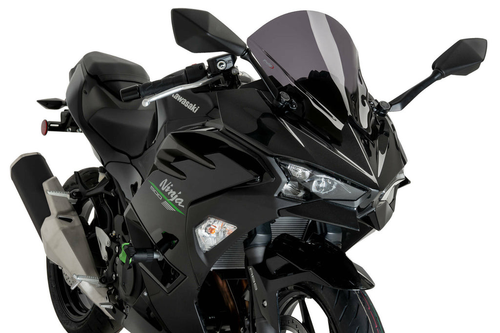 PUIG dark smoke Z-Racing motorcycle windscreen for Kawasaki, sleek windshield with tinted finish.