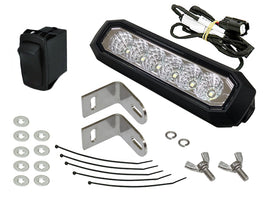 SP1 auxiliary LED headlight S-D 54-10400 emitting bright illumination, mounted on a vehicle for enhanced visibility.