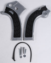 Acerbis X-Grip Off-Road Frame Guard in silver and black mounted on a motorcycle frame, providing protection and style.
