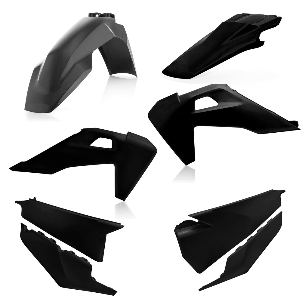 Acerbis black plastic kit with various automotive or motorcycle parts, assembled on a flat surface for installation or repair.