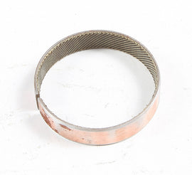 SP1 clutch bushing S-D 53-22203 installed in a vehicle's clutch system, showing the cylindrical metal component.