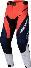 Alpine Star Pro-Dura Pants in navy, hot orange, and white, size 34, featuring durable fabric and stylish design.