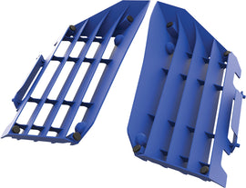 Blue Polisport Plastics radiator louvers for off-road vehicles, model 64-56504, shown installed on a motorcycle radiator.