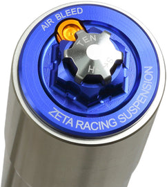 Blue ZETA suspension front fork top cap, designed for ZETA forks, featuring a sleek finish and precise fit.