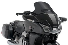 PUIG touring windscreen in dark smoke, motorcycle windshield, provides wind protection and style, with a sleek curved design.