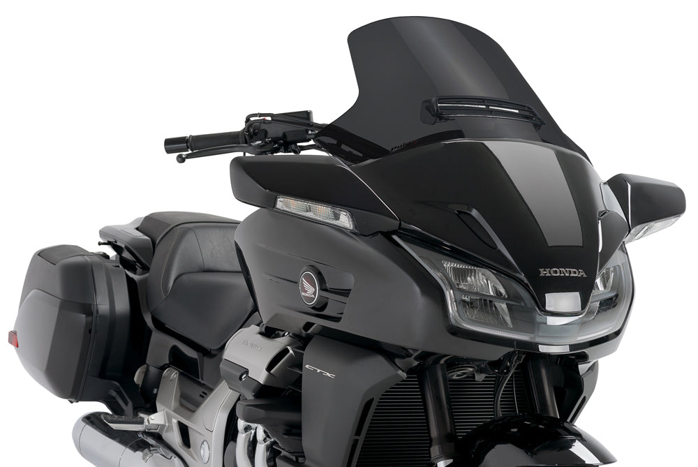 PUIG touring dark smoke windscreen for motorcycle, with tinted shield and aerodynamic design, mounted on bike.