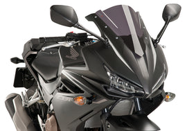 PUIG Racing Dark Smoke Windshield for motorcycle, lightweight windscreen with tinted dark smoke finish, aerodynamic design.