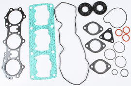SP1 full gasket set for engine, including seals and gaskets, laid out on a flat surface for automotive repair.