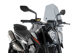 PUIG Naked New Gen Sport Smoke Windscreen for KTM motorcycle, clear, aerodynamic windshield with tinted smoke finish.
