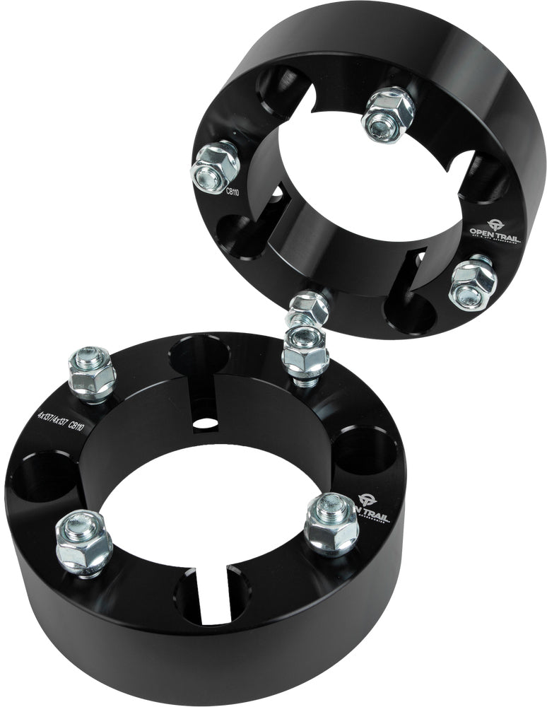 Open Trail 2-inch wheel spacer for 4/137 stud pattern, featuring 12mm x 1.25mm threaded holes, displayed on vehicle wheel assembly.