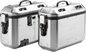 Pair of GIVI Dolomiti Monokey side cases in silver, 36L luggage for motorcycles, shown mounted on a bike.