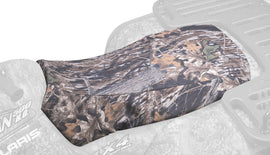 Kolpin Mossy Oak Break-Up seat cover for storage, made of durable material, designed to protect and enhance ATV or vehicle seats.