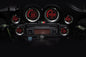 Koso North America HD-02 Series gauge kit with silver bezel displaying oil temperature readings on a motorcycle dashboard