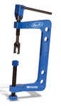 Motion Pro T-6 Valve Spring Compressor tool for engine valve maintenance, shown with handles and compression jaws.