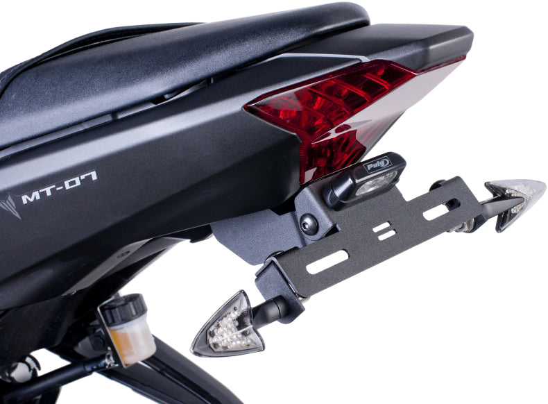 Black PUIG Fender Eliminator Kit installed on motorcycle body, showing sleek design and mounting components.