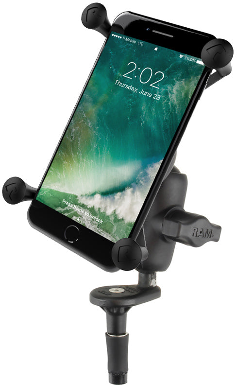 Ram X-Grip Phone Holder 71-7045 accessory mounted on a vehicle dashboard with a phone secured in the grip.