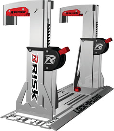 Risk Racing Lock N Load Mini Pro tie-down straps secured to a motorcycle for safe transportation.