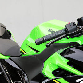 Black Shogun Industries bar end sliders attached to motorcycle handlebars, designed for protection and style.