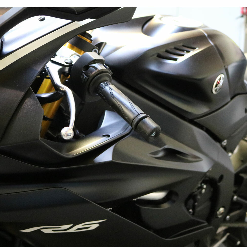 Black Shogun Industries bar end sliders mounted on motorcycle handlebars, showcasing sleek body protection.
