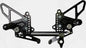 Black VORTEX rear set foot controls for Ducati, complete with foot pegs and shift/brake levers, designed for motorcycle performance.