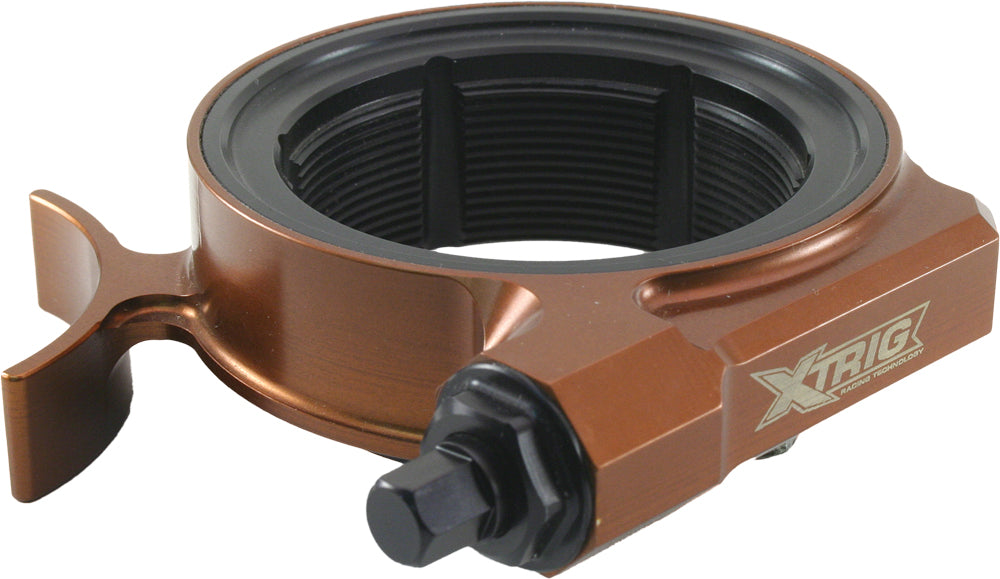 XTRIG pre-load adjuster for Honda suspension system, showing the black metal component with adjustment knob and mounting hardware.