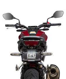 Yoshimura Fender Eliminator Kit for Honda motorcycle, showing sleek body design and mounting hardware in a close-up view.