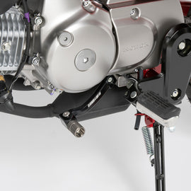 ZETA Revolver shift lever for motorcycles, showing the black metal lever with textured grip and mounting hardware.